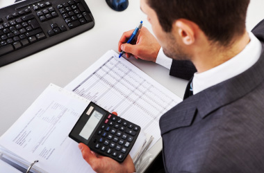  Man using a calculator to get an estimate